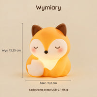 Wymiary lampki nocnej siedzący lis: 12,25 cm wysokości i 11,2 cm szerokości