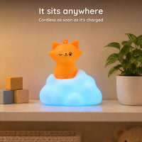 Fox on cloud night light with a blue glow on a child's bedroom shelf, cordless once charged